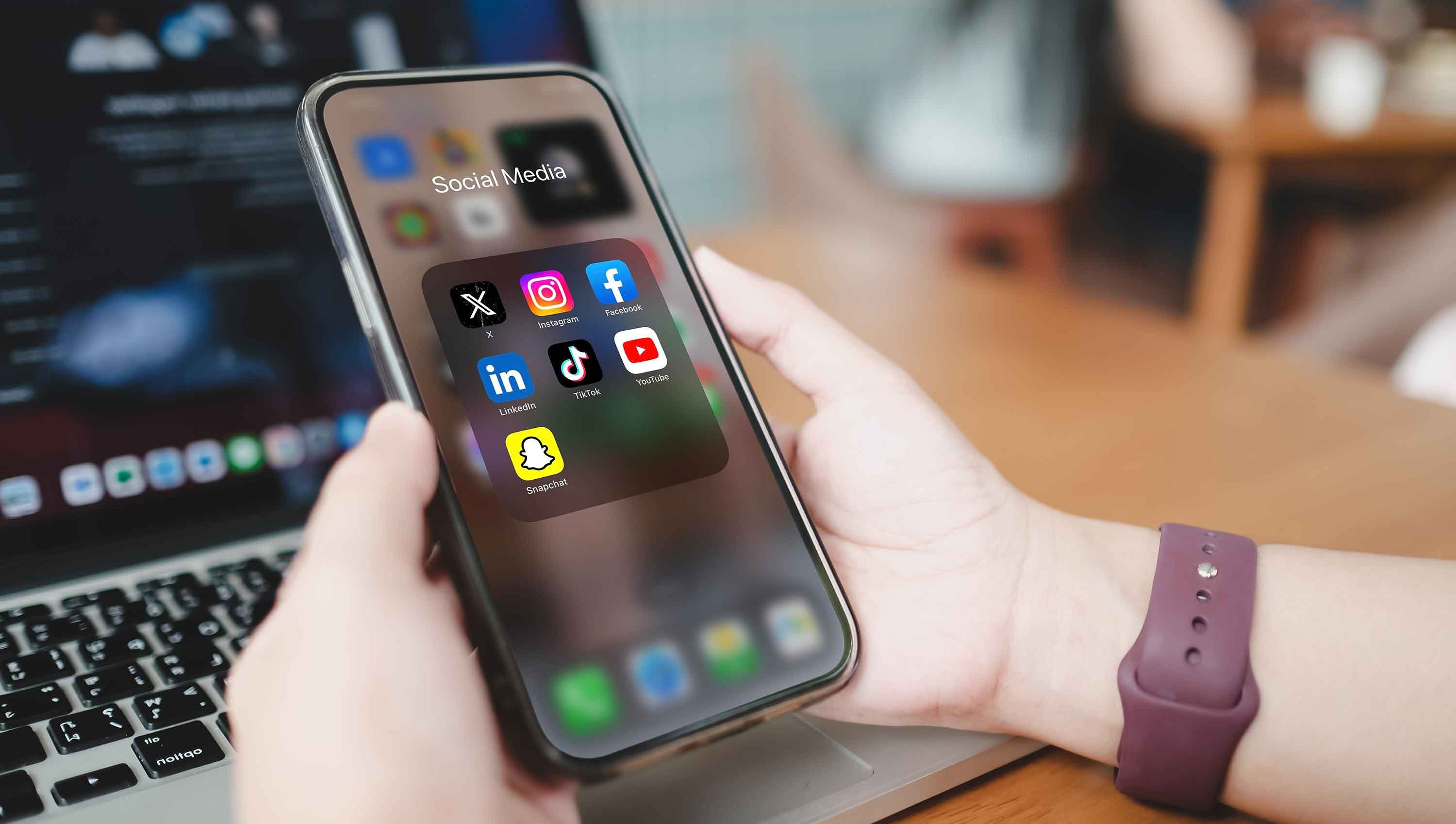 Close-up-of-phone-showing-social-media-apps