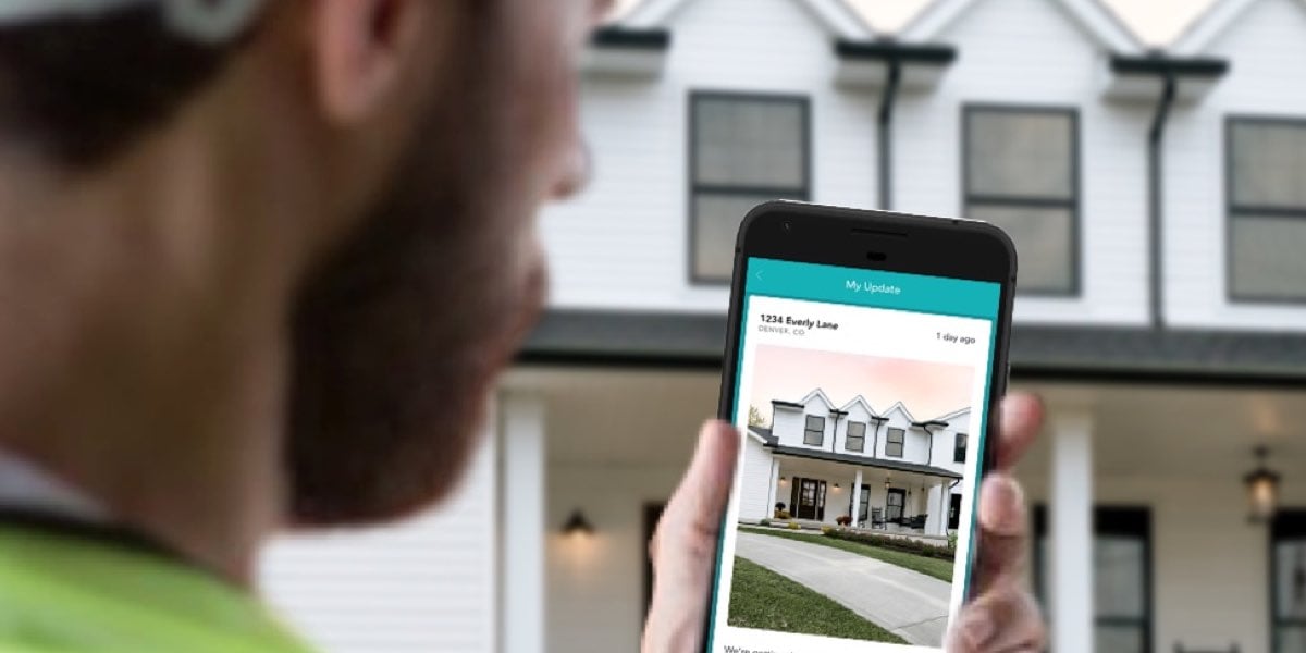 Construction worker using app to take home photo