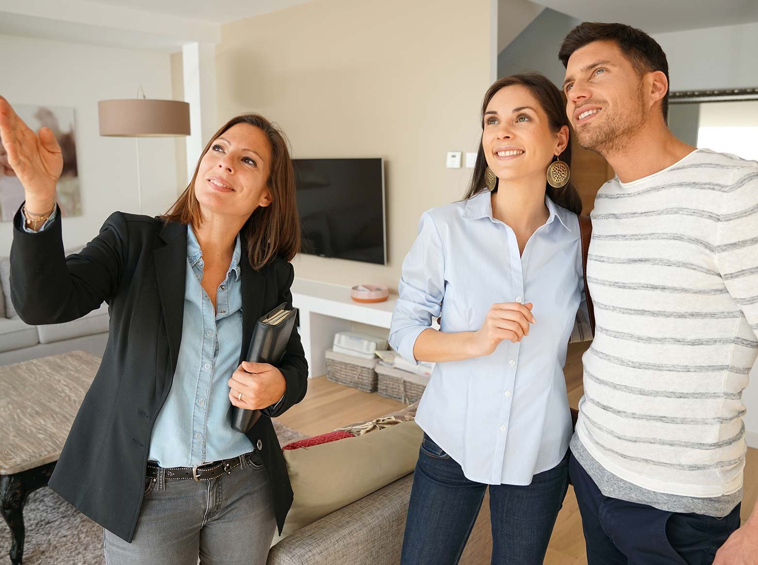 Couple talking with new sales person
