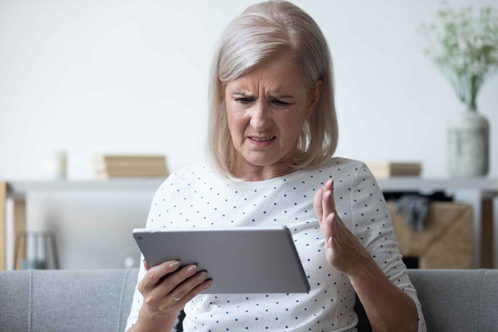 Frustrated-woman-looking-at-ipad