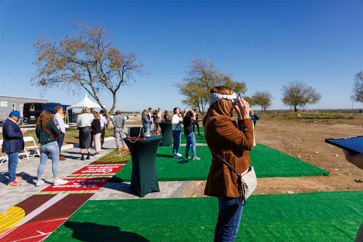 Home-Builder-Event-with-prople-using-augmented-reality-to-view-home-sites