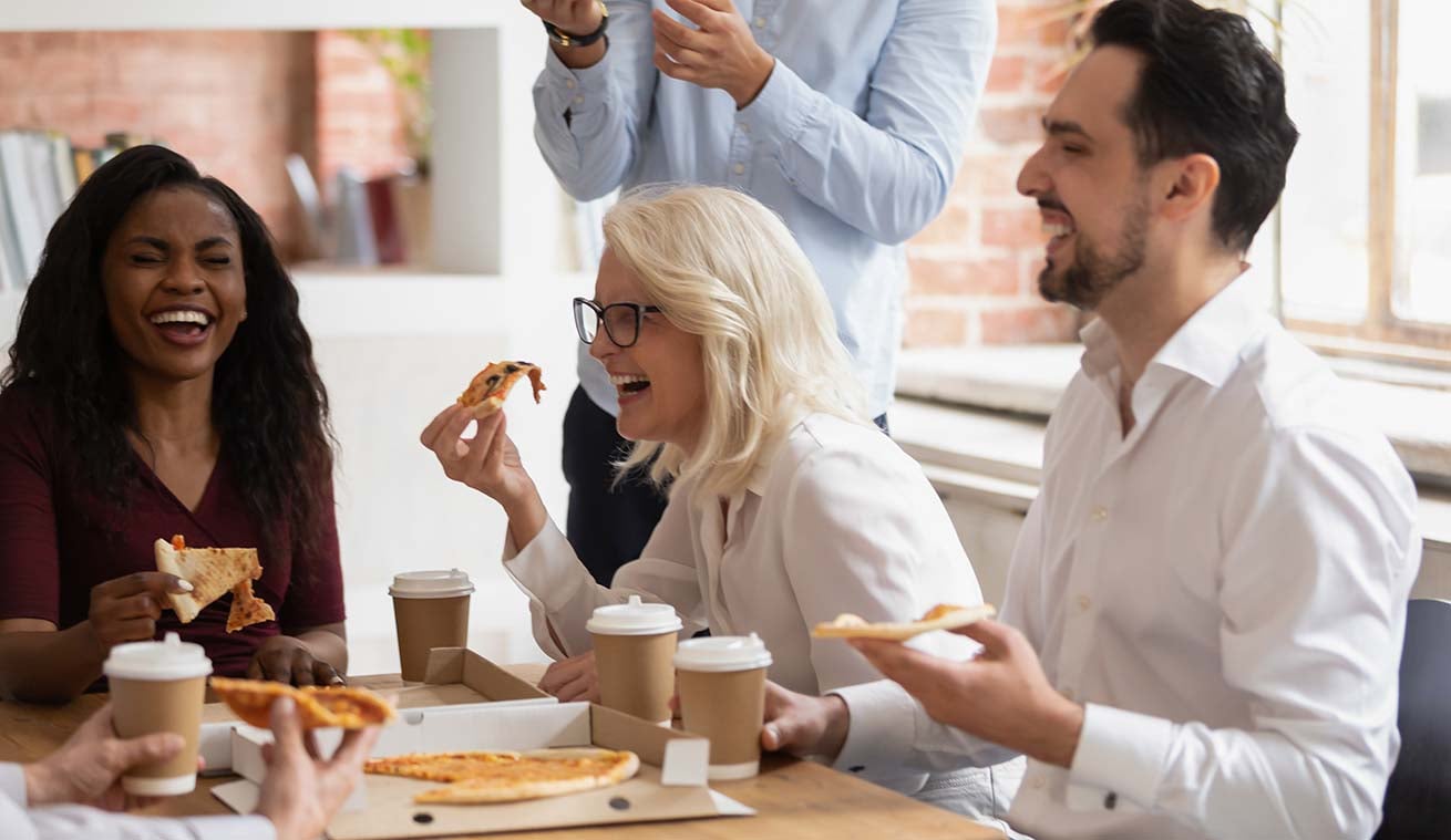 Home builder employees laughing and having fun at work