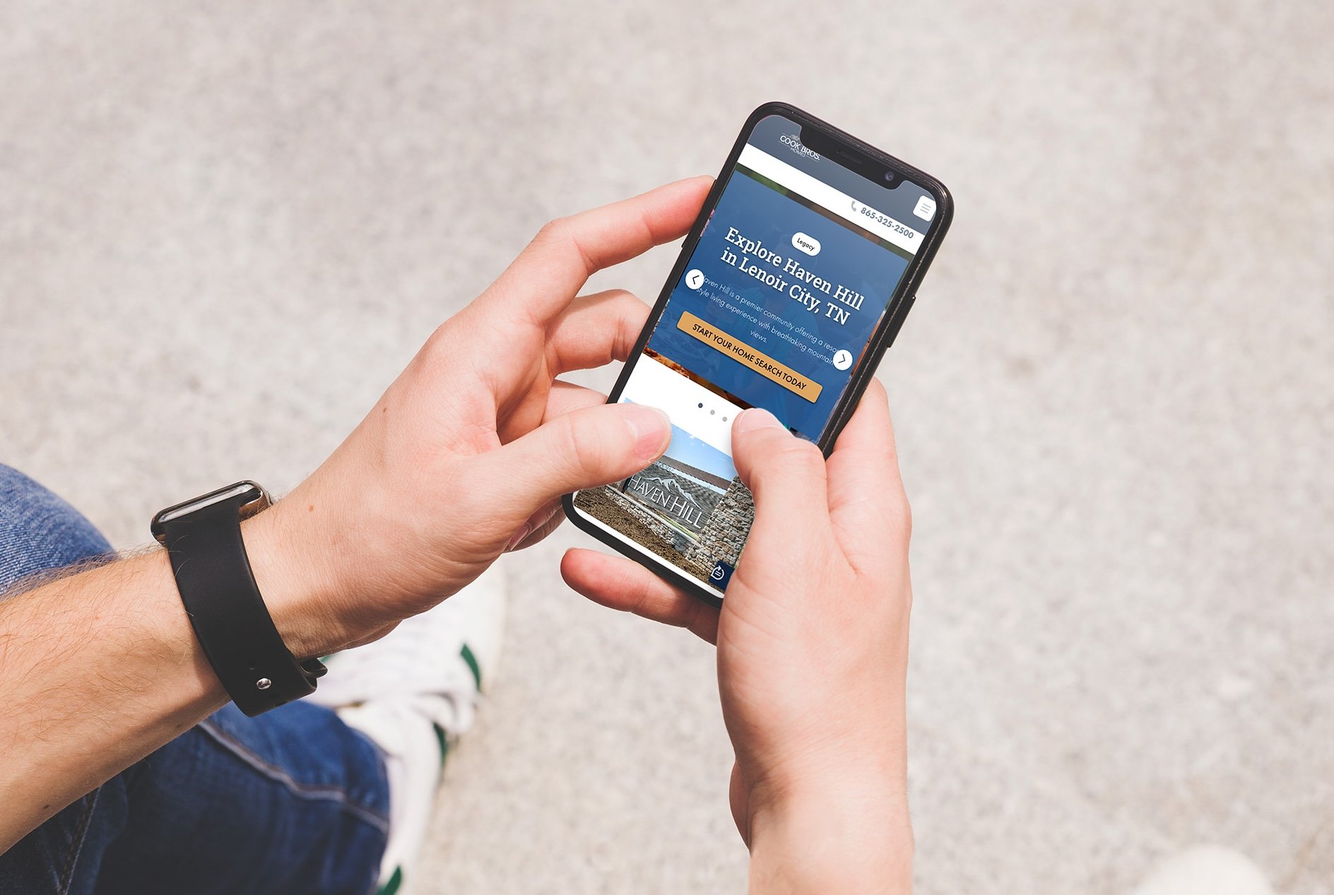 Man holding iPhone outdoors - jeans