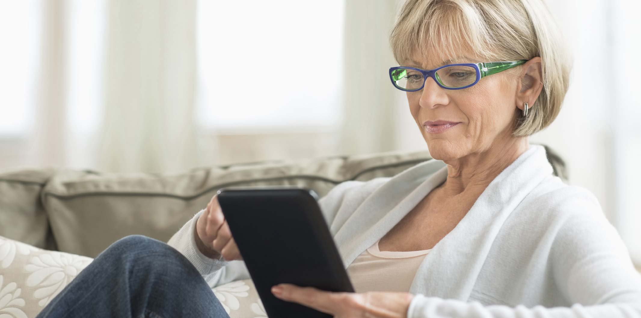 Woman looking at home builder web site on her ipad - Karen