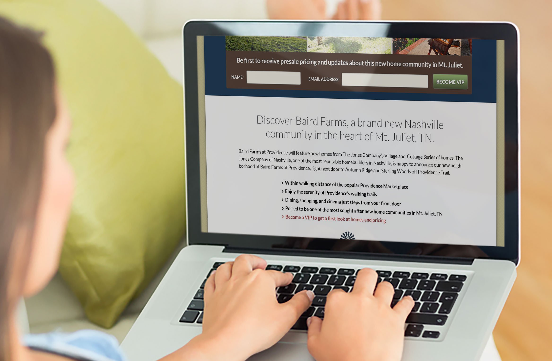 Woman-on-computer-reading-home-builder-landing-page