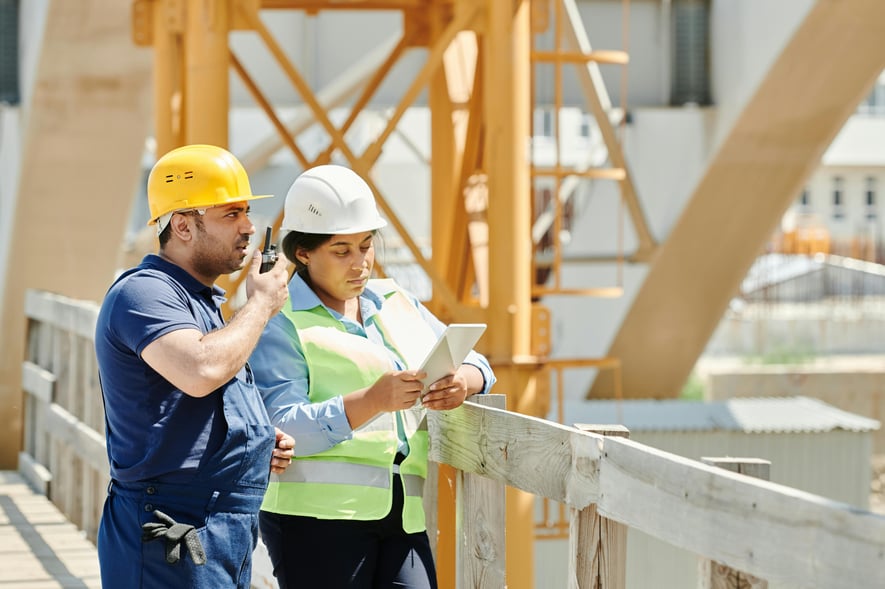 Team reviewing digital plans onsite