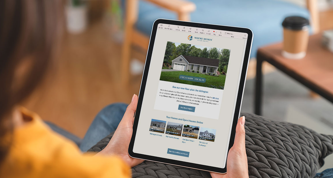 Home Builder email marketing on an iPad with woman previewing it