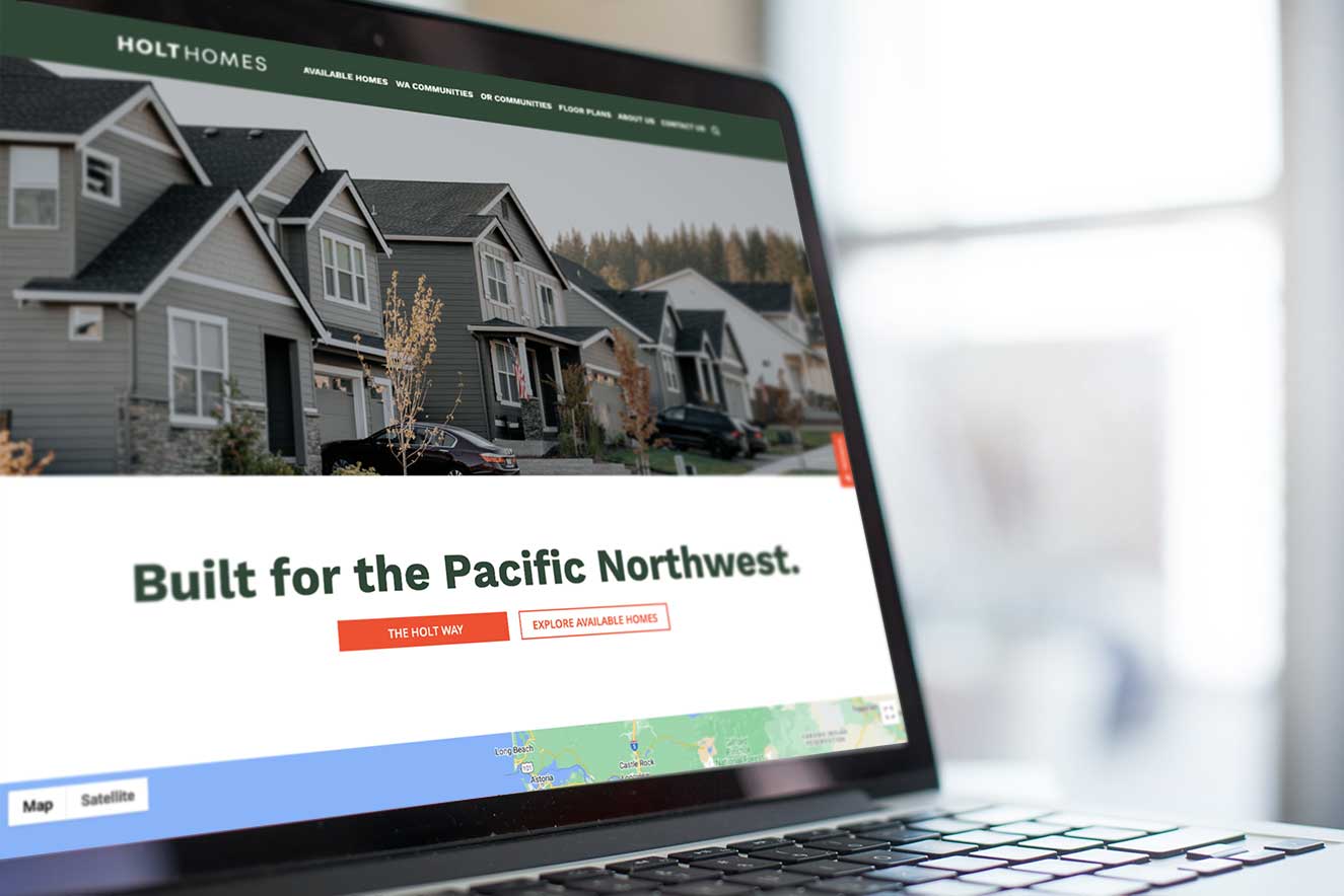 Laptop-showing-website-redesign-for-Holt-Homes